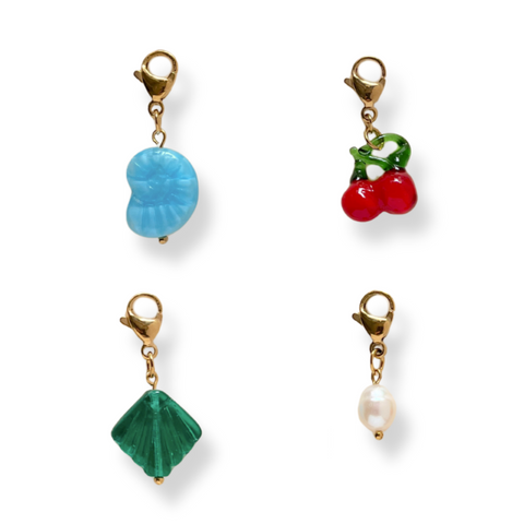 Set of four colorful charms of cherry , pearl and a seashell